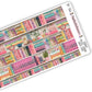 Close up view of pastel coloured bookshelf themed washi strip sticker sheet with 5 stickers, in a crochet-like texture. 