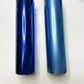 a couple of blue tubes sitting on top of a table