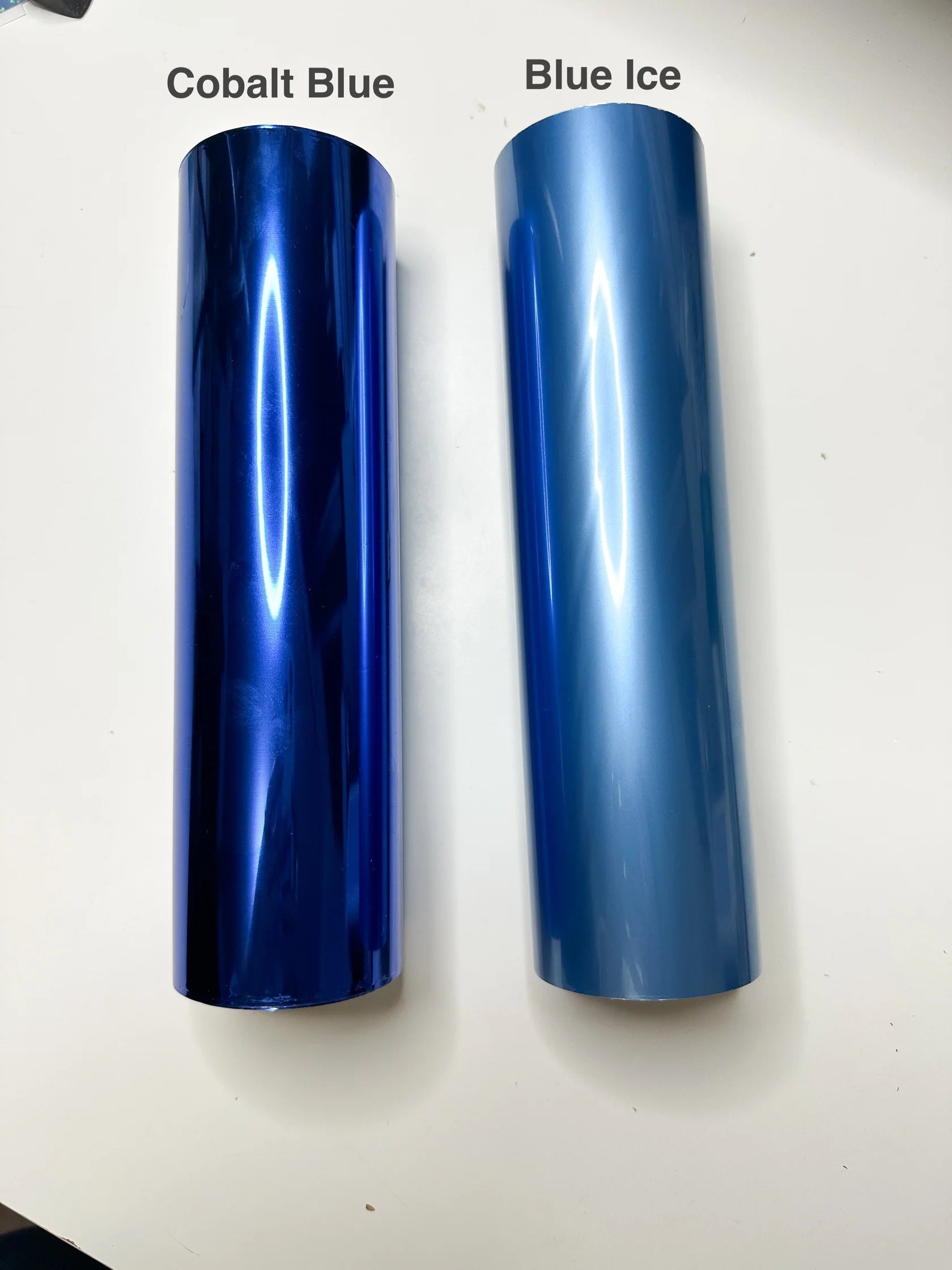 a couple of blue tubes sitting on top of a table