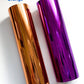 a close up of two metal tubes on a white surface