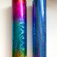 a pair of blue and a rainbow colored tube